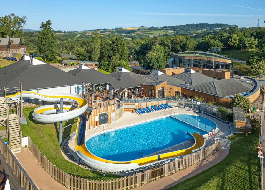 the outdoor swimming pool with slides at Finlake Resort & Spa holiday park in Devon