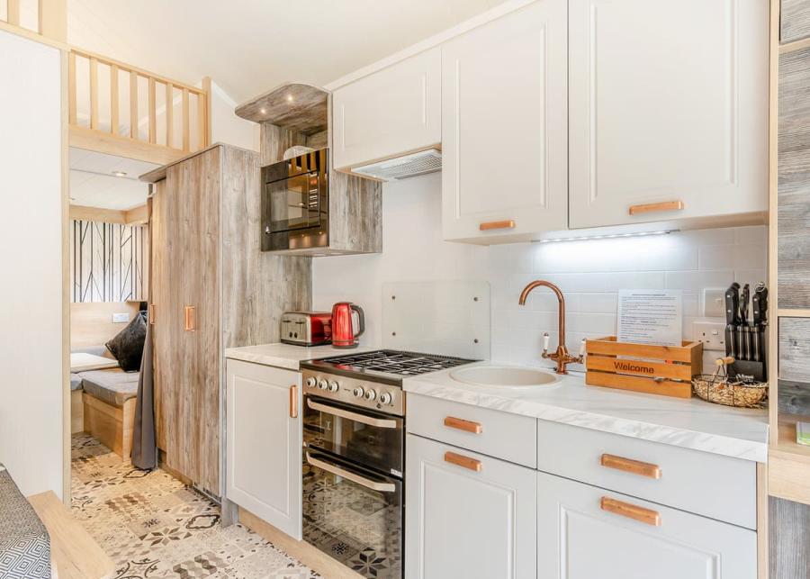 contemporary kitchen in a lodge at Augill Beck Holiday Park in Kirkby Stephen