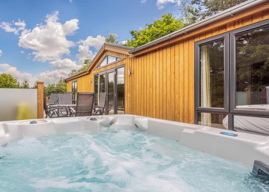 hot tub in a luxury lodge at sandybrook lodge holiday park