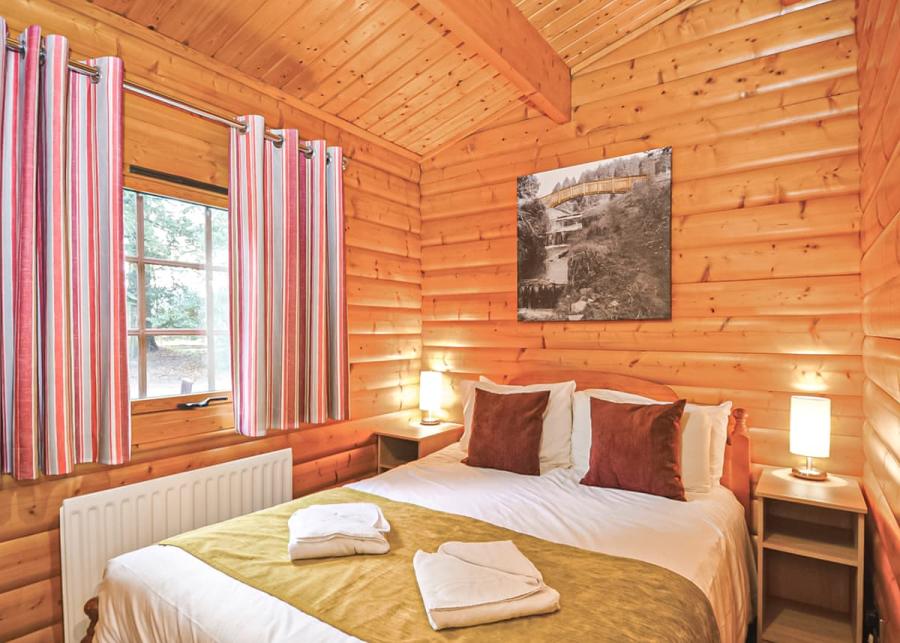 double bed in log cabin