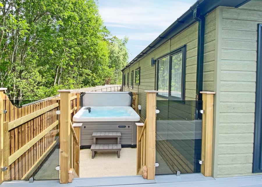 hot tub holiday lodge holidays at flusco wood holiday lodge 