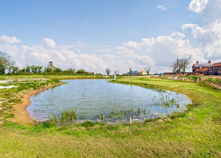 lake at play area at helsey farm cottages in helsey