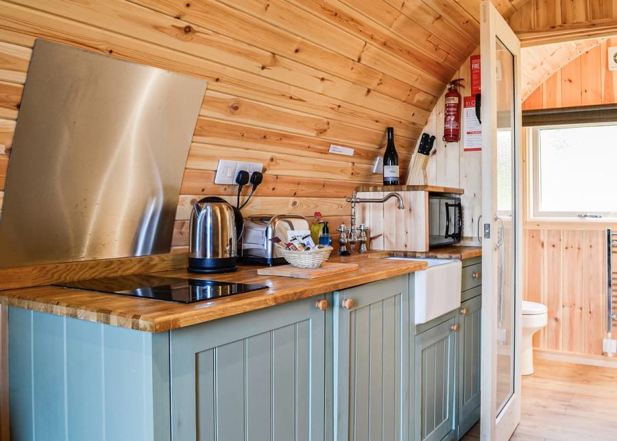 fully equipped kitchen in a glamping pod