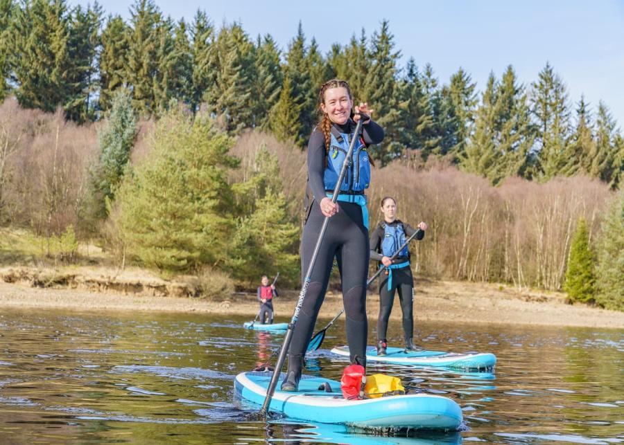 paddle boarding at kielder waterside holiday park 