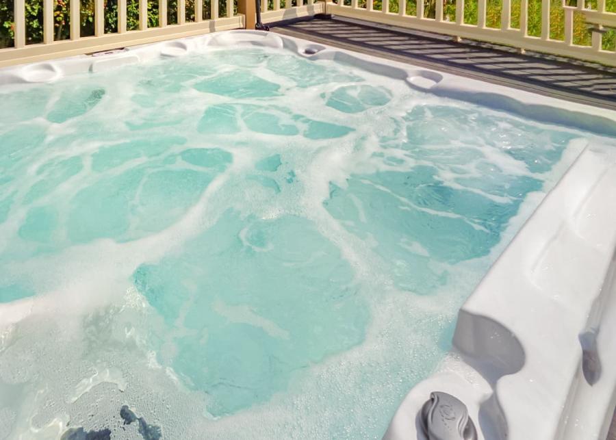 private hot tub in lodge at otters mead boutique lodges in norfolk
