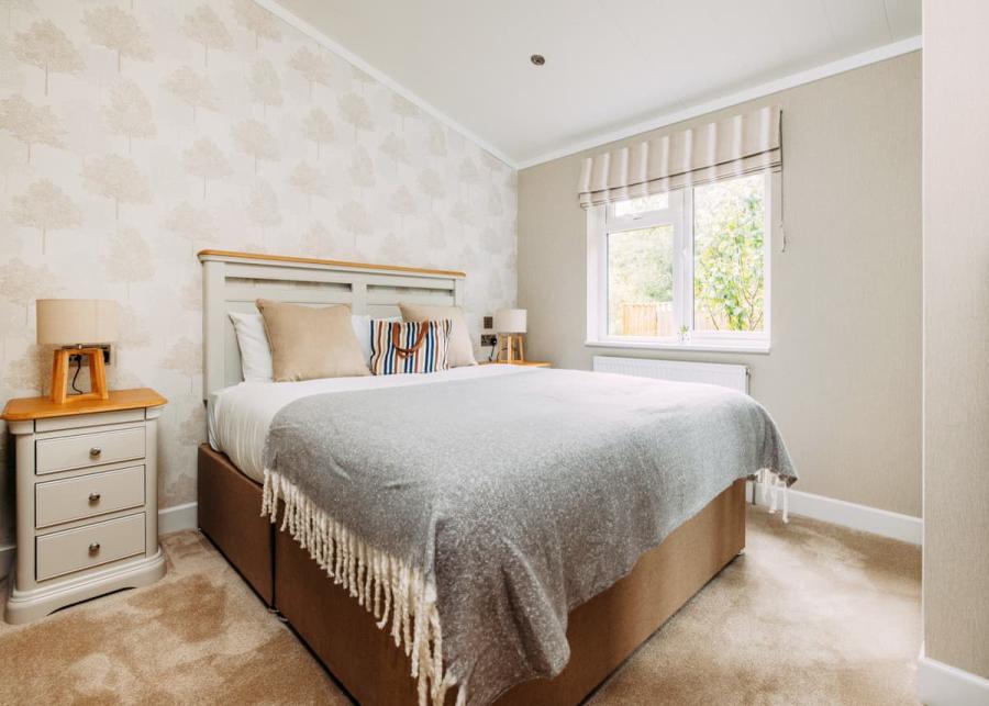 double bedroom at brokerswood holiday park 