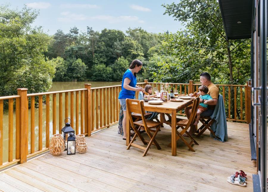 private lodge decking at brokerswood holiday park in westbury