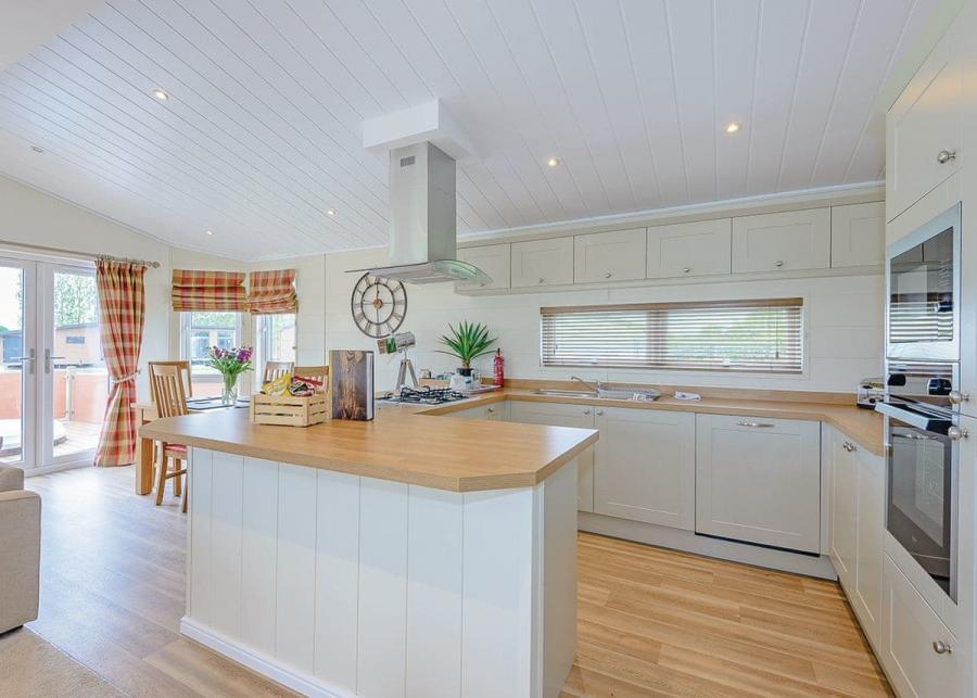 modern kitchen in a lodge at maesmawr farm resort in powys
