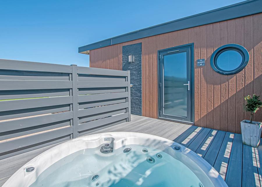 lodge with a tot tub at maesmawr farm resort in powys