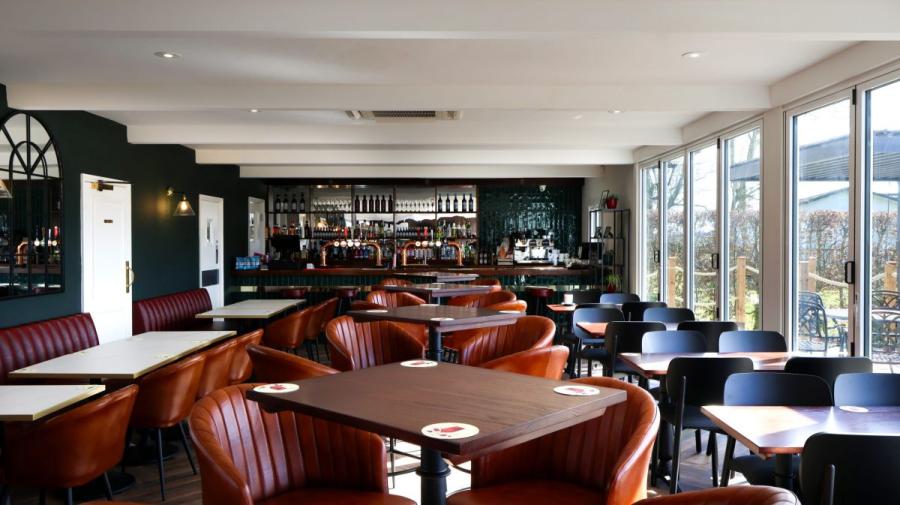 bar seating area with views at Cakes and Ale Holiday Park