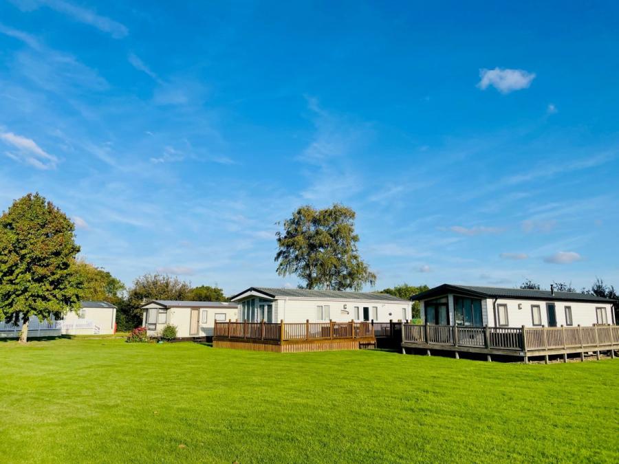 luxury lodges in sapcious fields at Cakes and Ale Holiday Park
