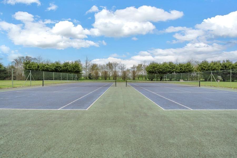 the tennis courts at Cakes and Ale Holiday Park