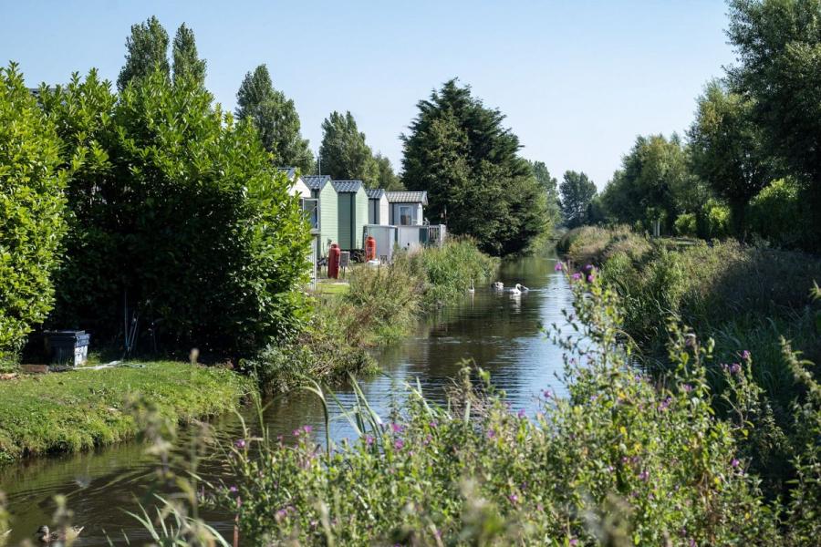 caravans by the river at Riverside Holiday Park