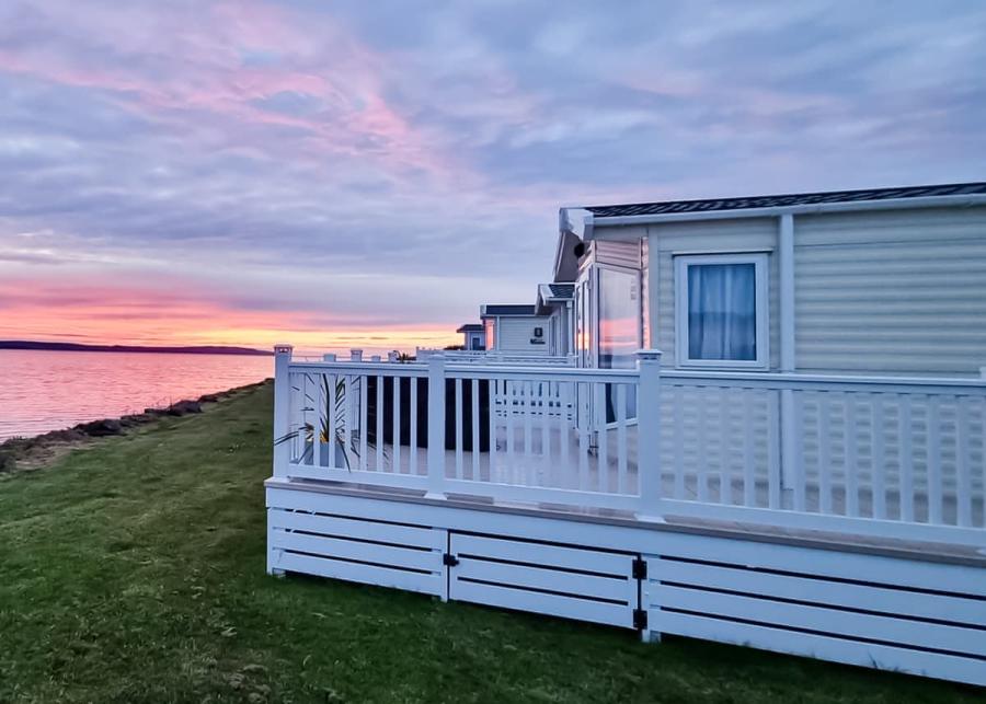 caravans with outdoor decking at ryan bay holiday park in stranraer