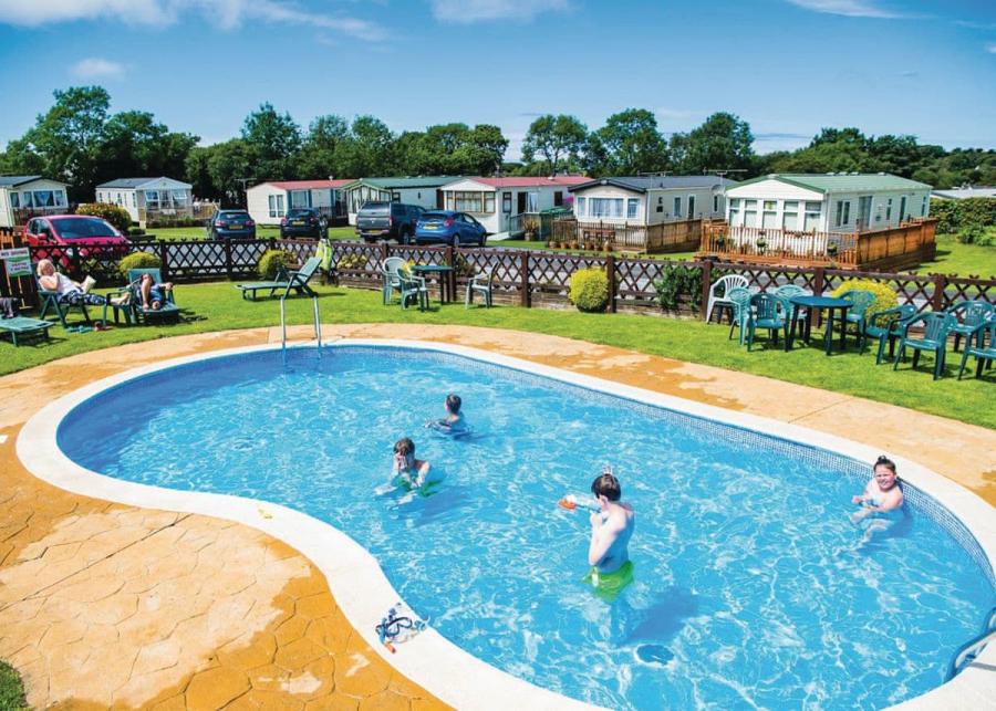 outdoor swimming pool at the village holiday park in new quay