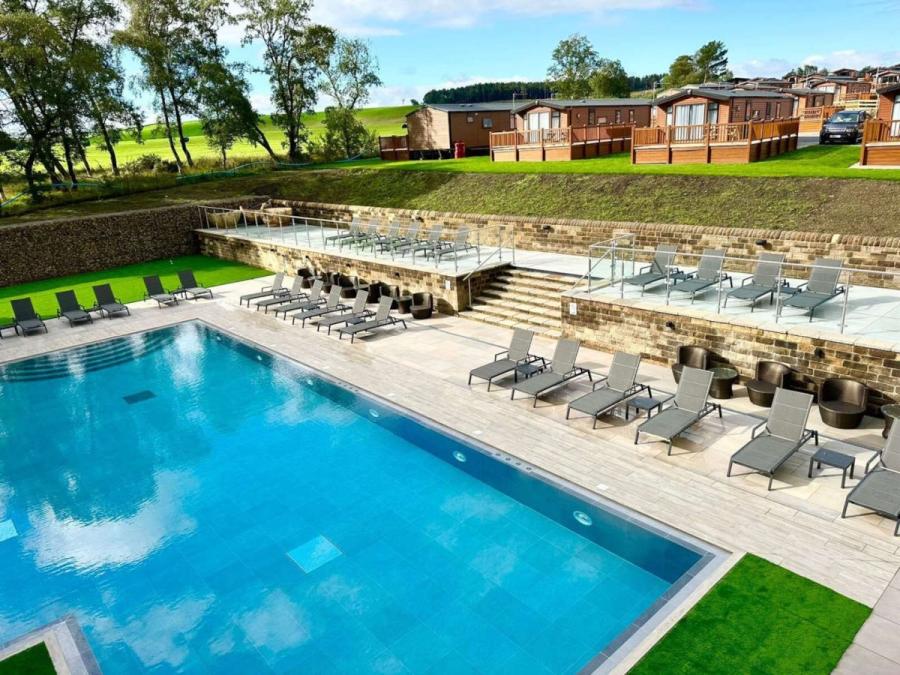 Wild Rose Holiday Park outdoor swimming pool with loungers