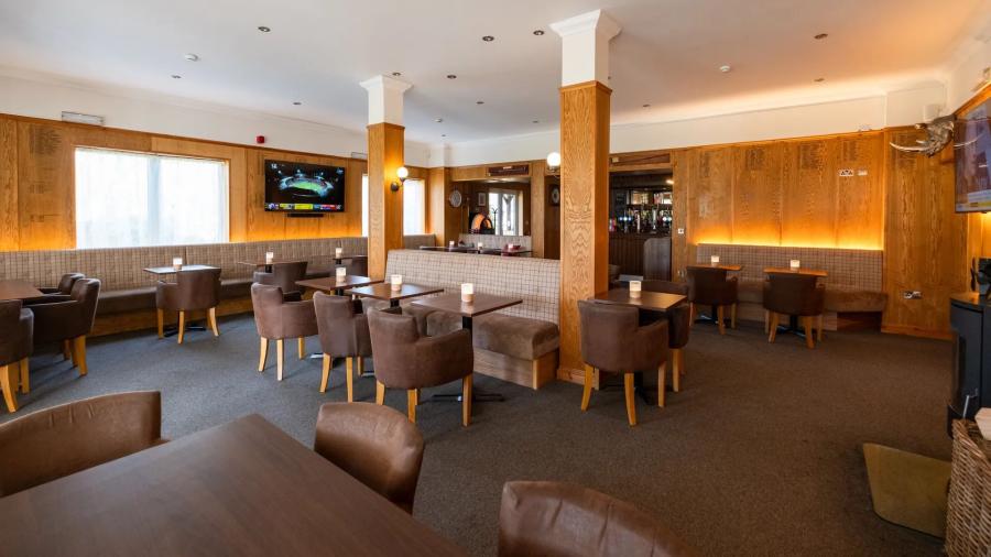 indoor bar with seating at Laceby Manor Resort