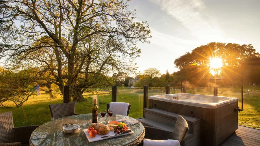 lodges with hot tubs on the balcony at Clowance Estate