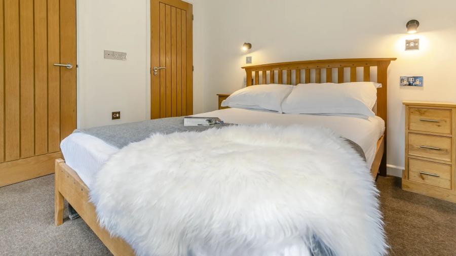 bedroom in a lodge at Leycroft Valley Holiday Park