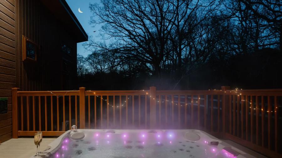 hot tub lodges at night at Rockingham Forest Holiday Park in northamptonshire