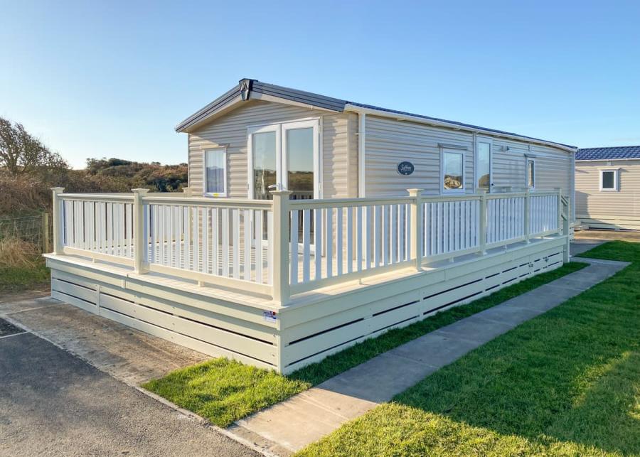caravan with decking at burrowhead holiday village 
