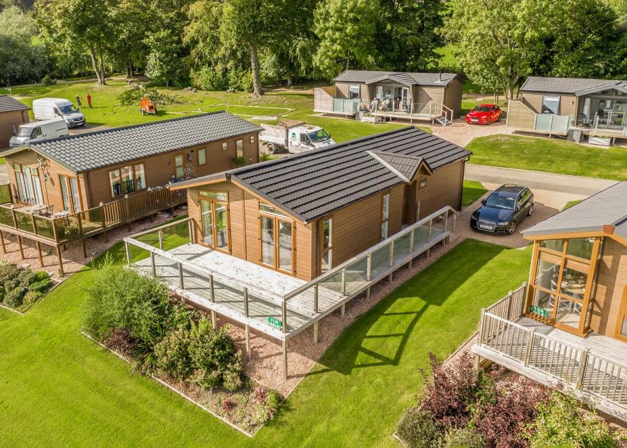 lodges with decking at letham feus holiday park in fife