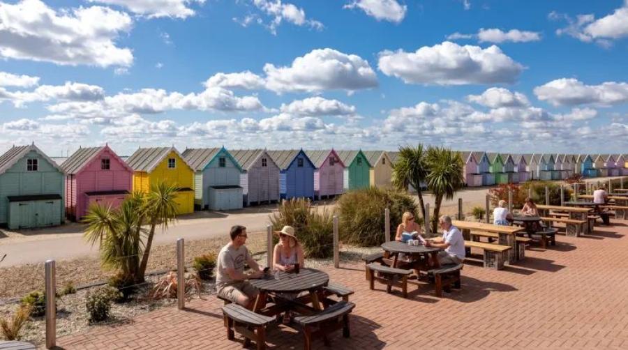 outside bar area with beach huts at West Mersea Holiday Park