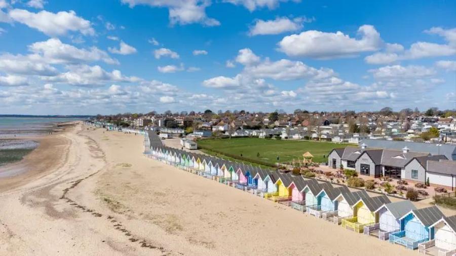 West Mersea Holiday Park by the beach and beach huts on Mersea Island